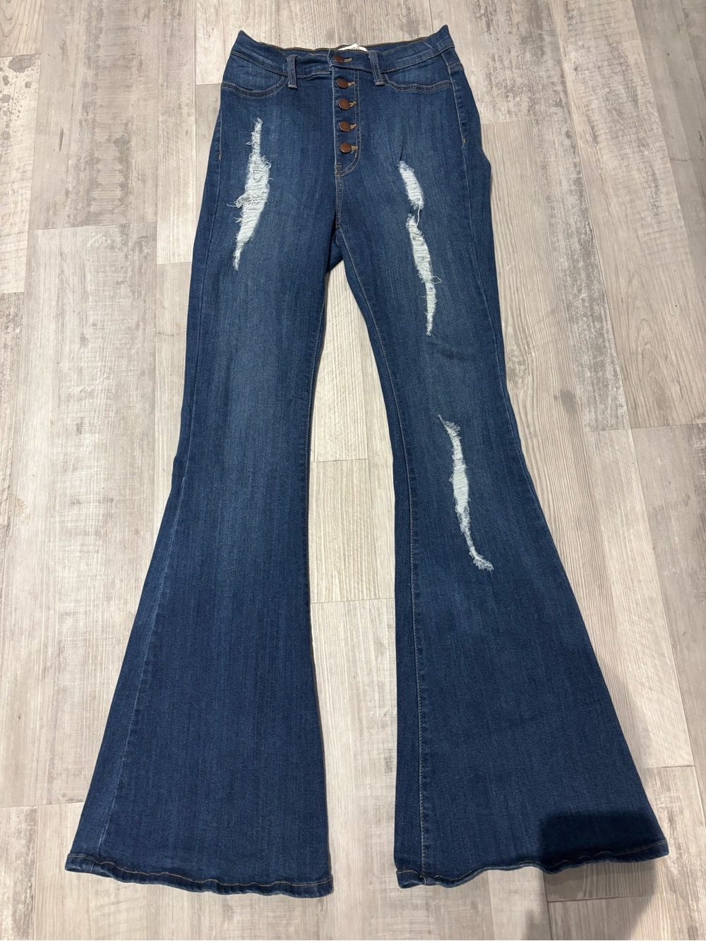 Vibrant Dark Blue Button-Front Flared Jeans with Distressed Detail